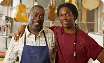 Image of two smiling black men used to introduce the prostate cancer resources and support page